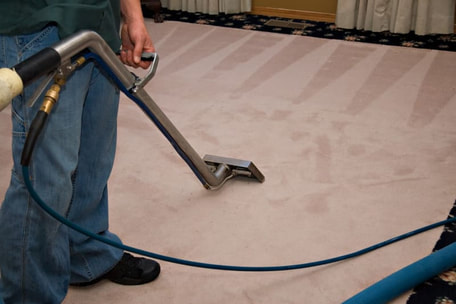 Carpet being hoovered by cleaner